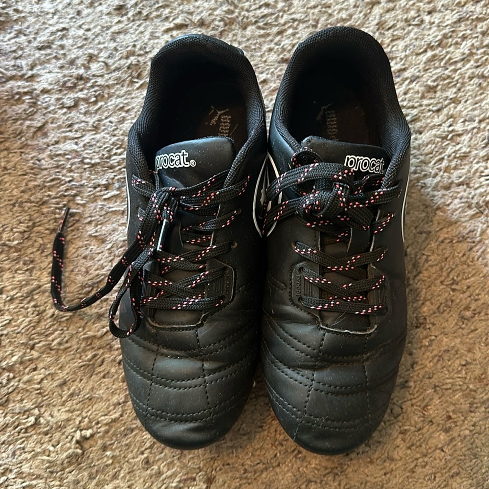 Puma Procat girls sports cleats.